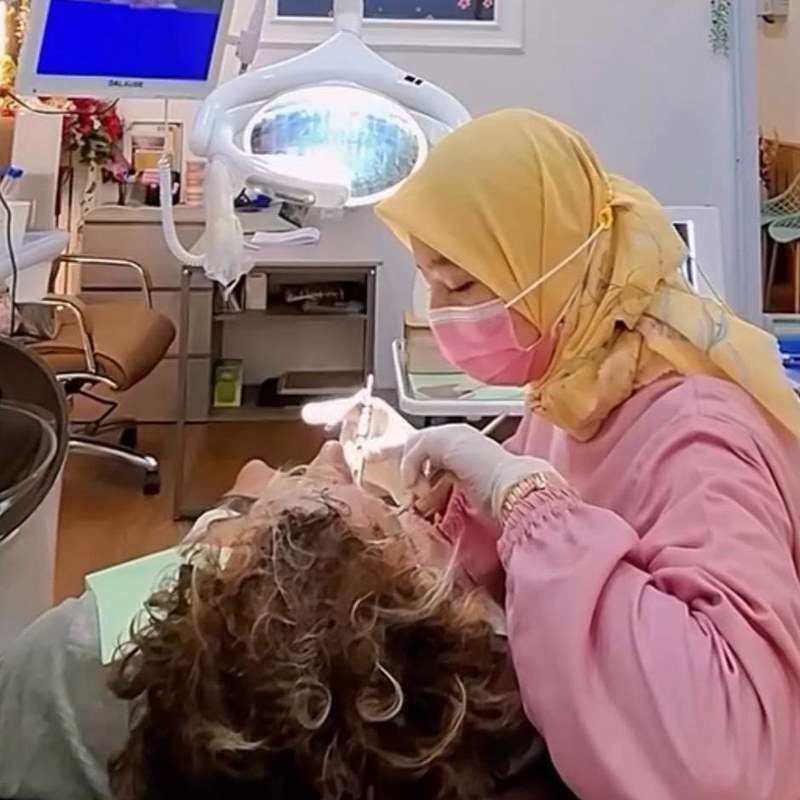 A dentist treating an international patient at Krystal Dental